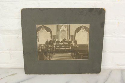 Matted Funeral Photograph of a Casket in a Church Surrounded by Mourners