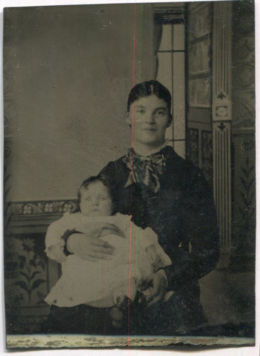 Tintype Photograph of a Smiling Mother with Her Baby