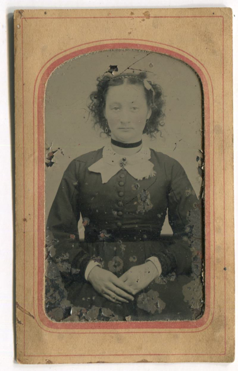 Tintype Photograph of a Woman with Crossed Hands in Paper Frame