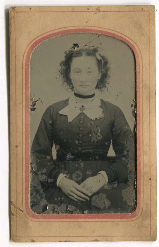 Tintype Photograph of a Woman with Crossed Hands in Paper Frame