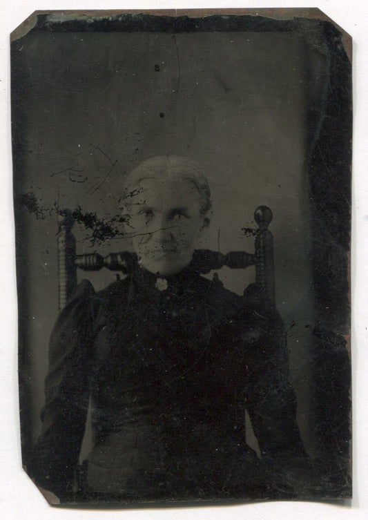 Tintype of an Older Woman in a Wooden Chair Dressed in Mourning Clothes