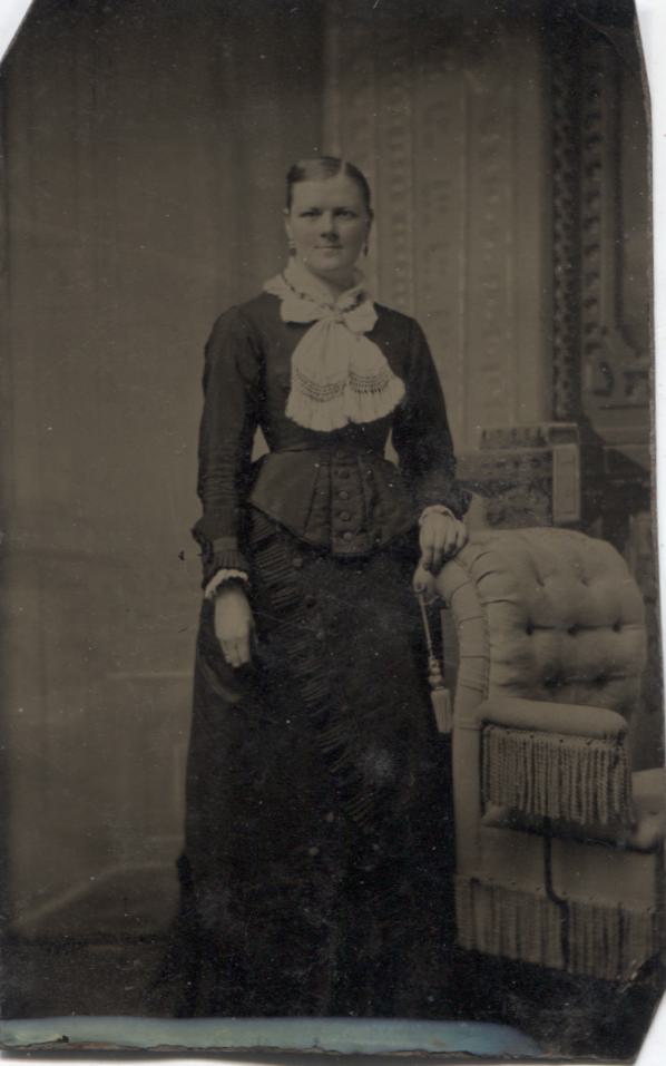 Tintype Photograph of a Woman Standing Next to a Chair