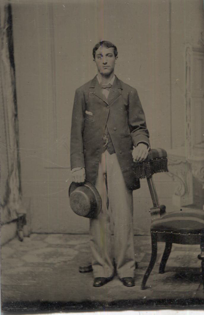 Tintype Photograph of a Standing Man with a Hat in His Hand