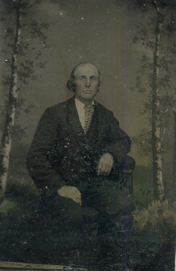 Tintype Photograph of a Seated Modern Looking Man with an Outdoorsy Backdrop